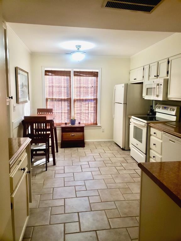 6500 Gaines Ferry Road, Unit I4 Flowery Branch, GA 30542 - Photo 16 of 30 a kitchen with stainless steel appliances a stove a sink and a refrigerator