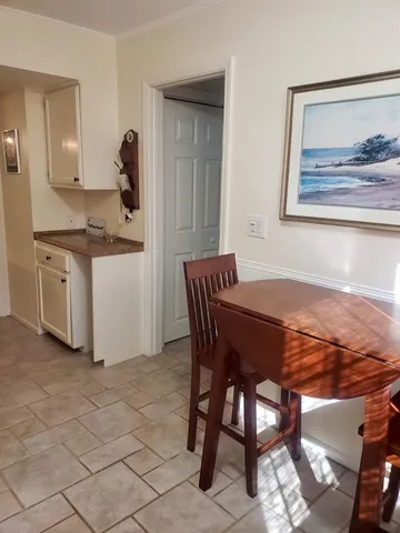 a bedroom with a bed and the view of bathroom