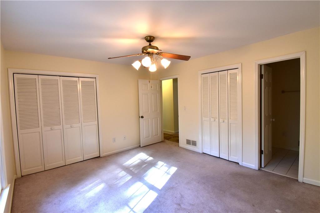 6500 Gaines Ferry Road, Unit I4 Flowery Branch, GA 30542 - Photo 23 of 30 an empty room with windows and fan