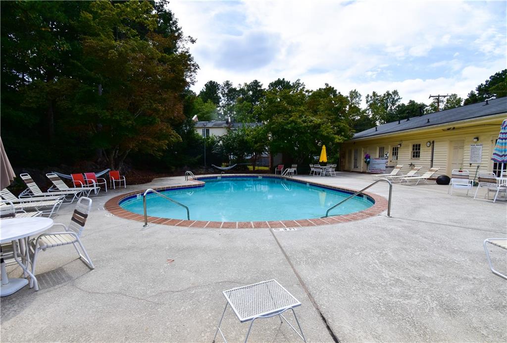 6500 Gaines Ferry Road, Unit I4 Flowery Branch, GA 30542 - Photo 29 of 30 a view of a swimming pool with a patio