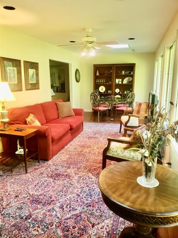 6500 Gaines Ferry Road, Unit I4 Flowery Branch, GA 30542 - Photo 10 of 30 a living room with furniture and a wooden floor