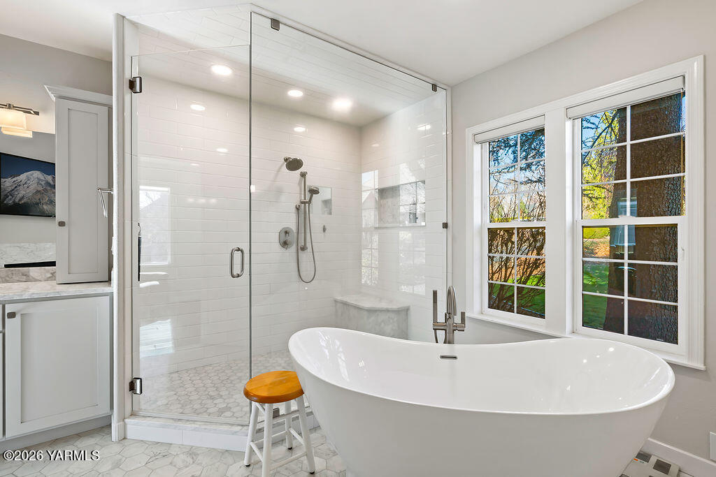 6810 Ravens Gate Way Yakima, WA 98908 - Photo 23 of 49 a bathroom with a sink and a shower