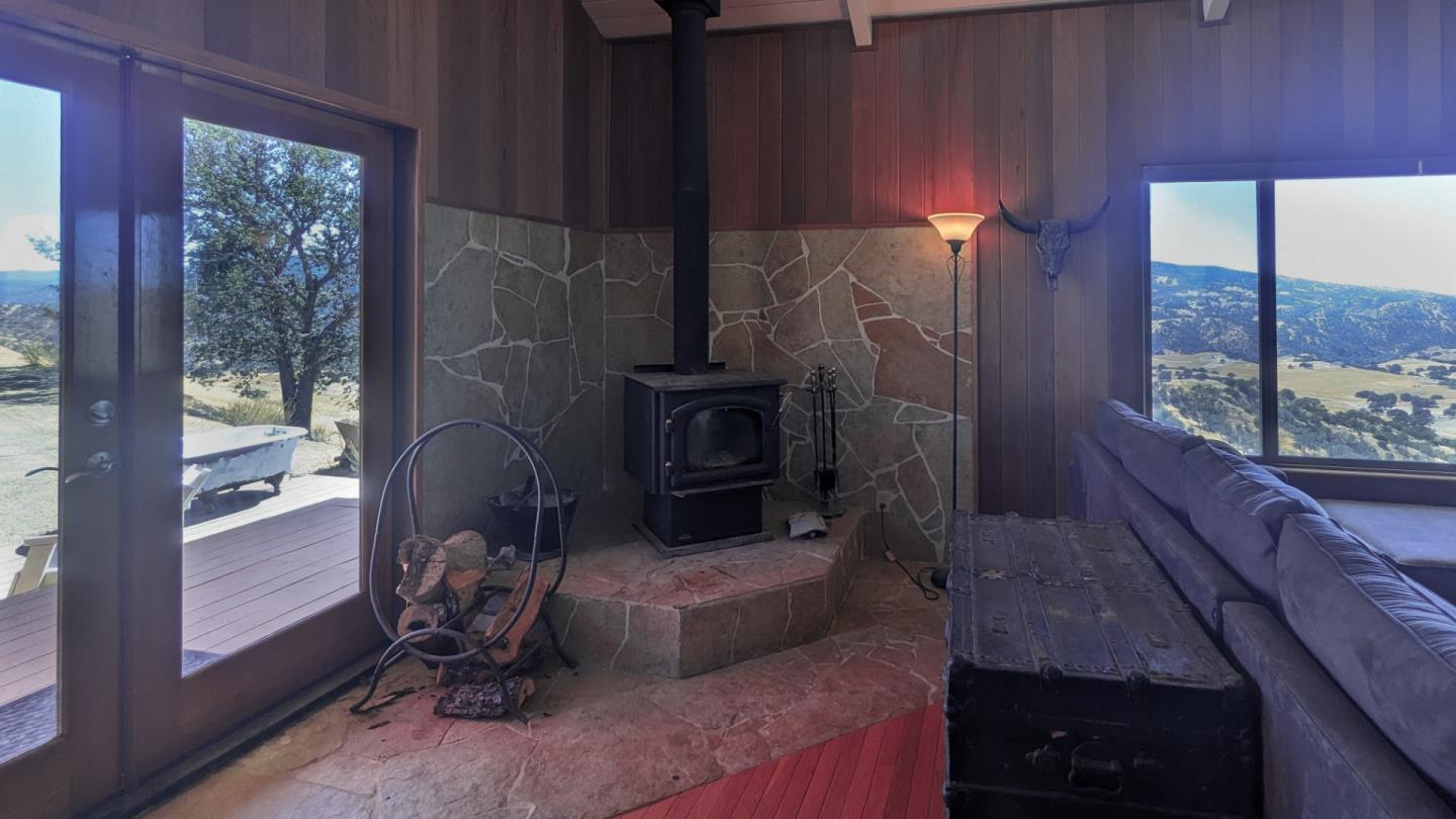 20473 Panoche Road Paicines, CA 95043 - Photo 15 of 19 a living room with furniture and a fireplace