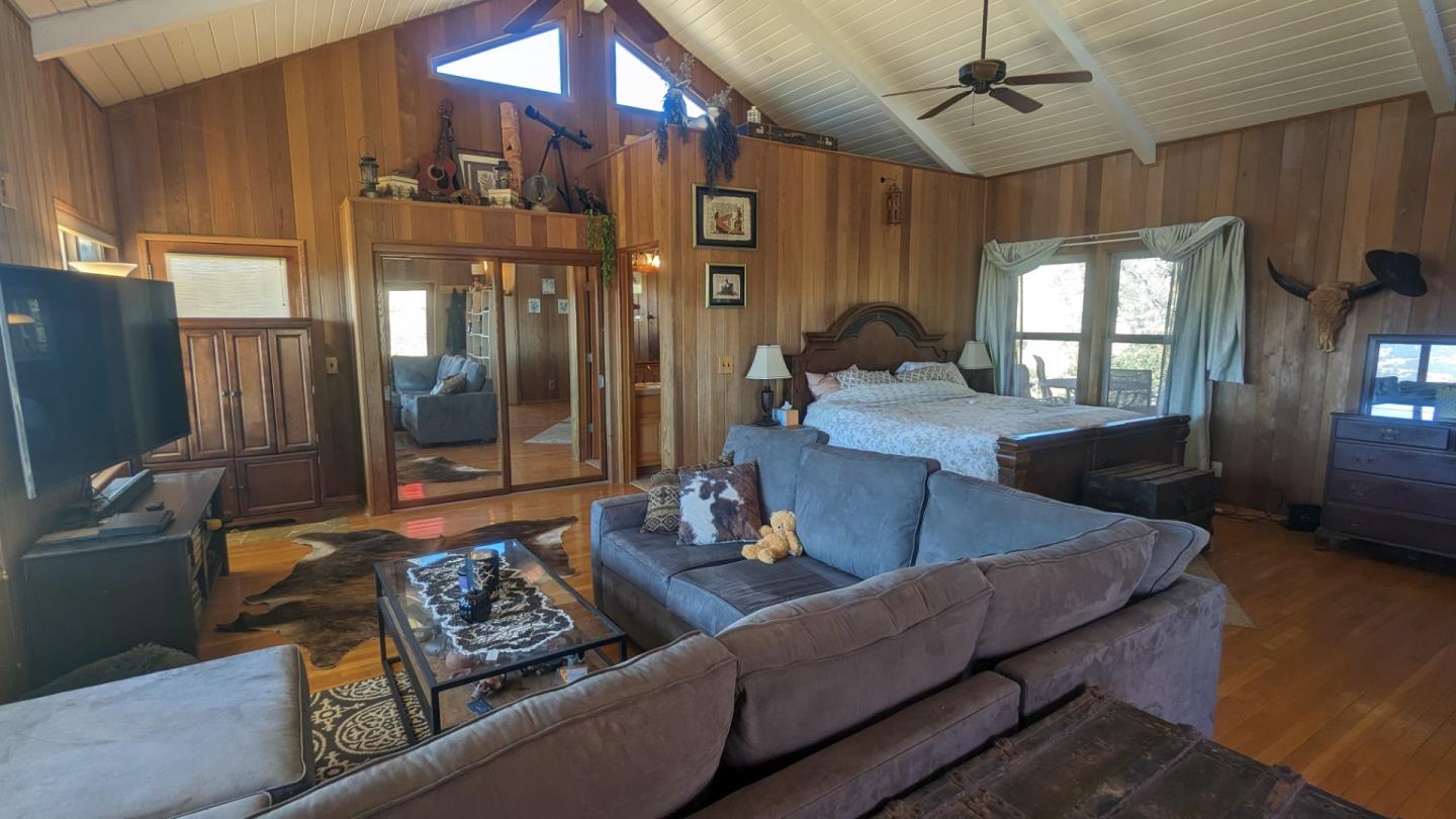 20473 Panoche Road Paicines, CA 95043 - Photo 18 of 19 a living room with furniture and a chandelier