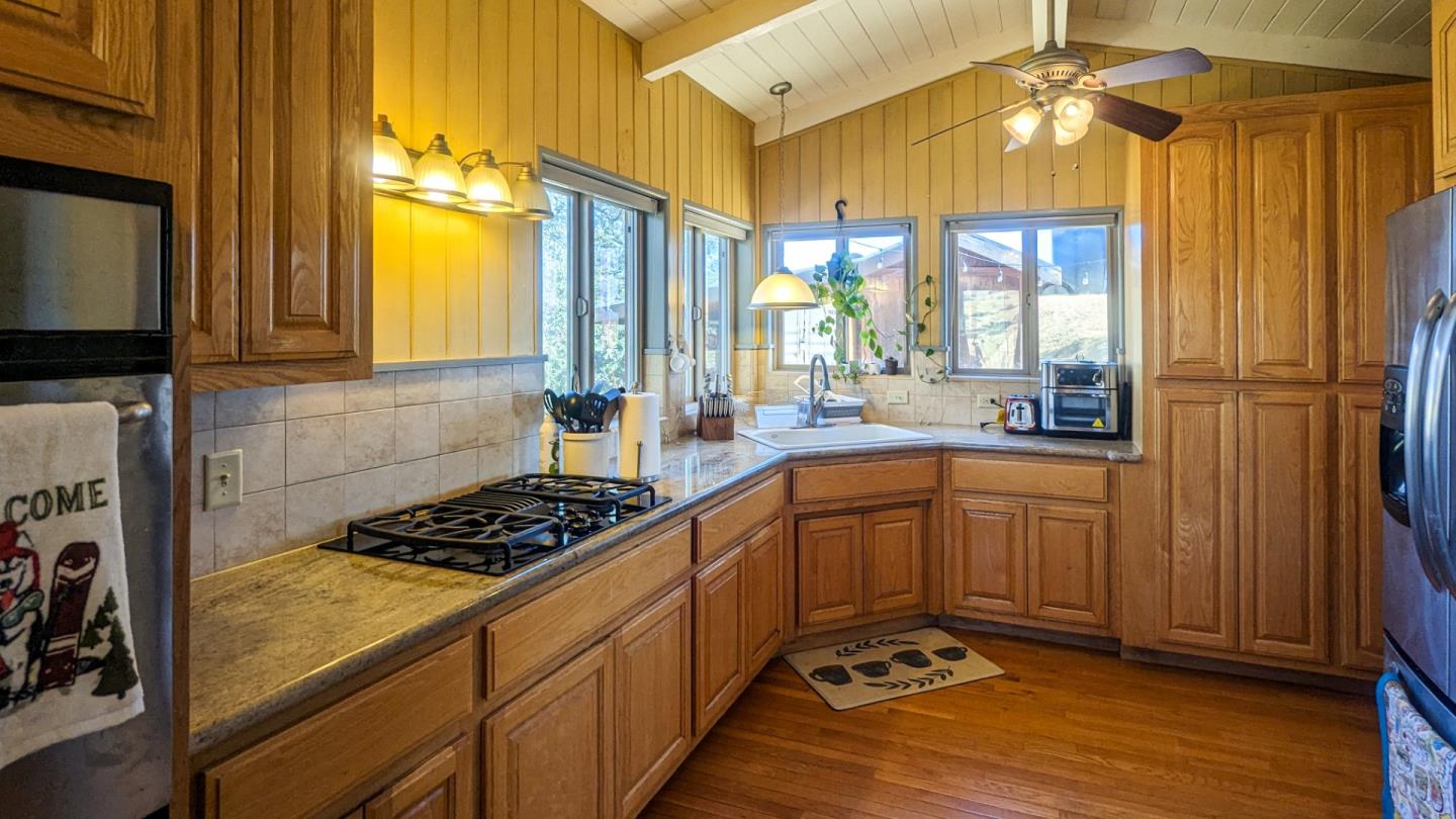 20473 Panoche Road Paicines, CA 95043 - Photo 10 of 19 a kitchen with sink cabinets and window
