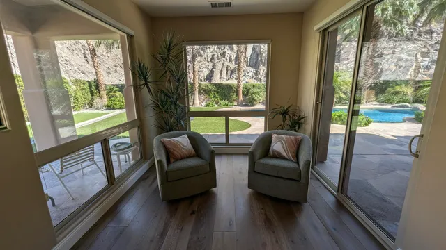 a bed room with a bed and a large window
