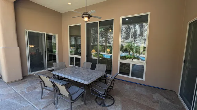 a view of a backyard with sitting area