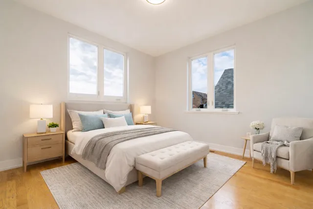 a bathroom with a double vanity sink toilet mirror and bathtub