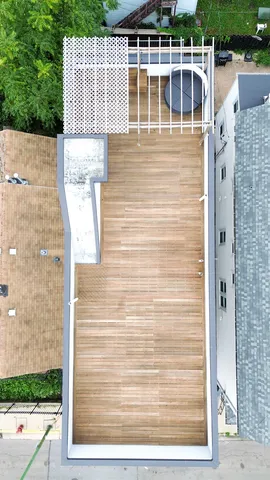 a view of an house with backyard and sitting area