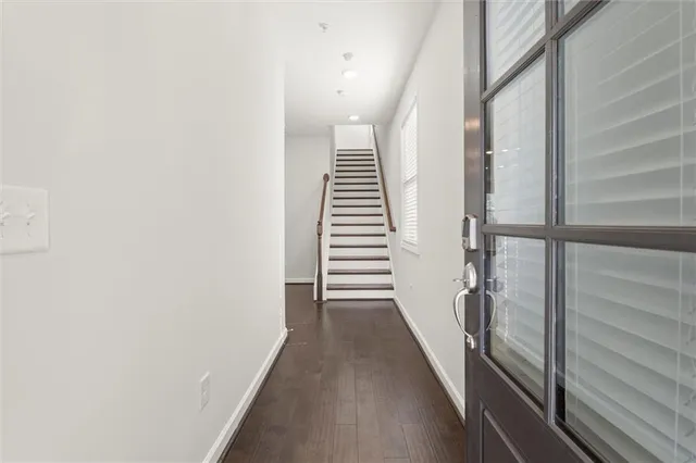 a view of a hallway with stairs