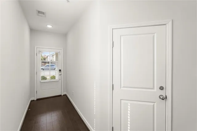 a view of an empty room and closet