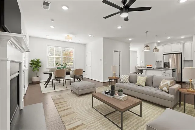 a living room with furniture and a fireplace