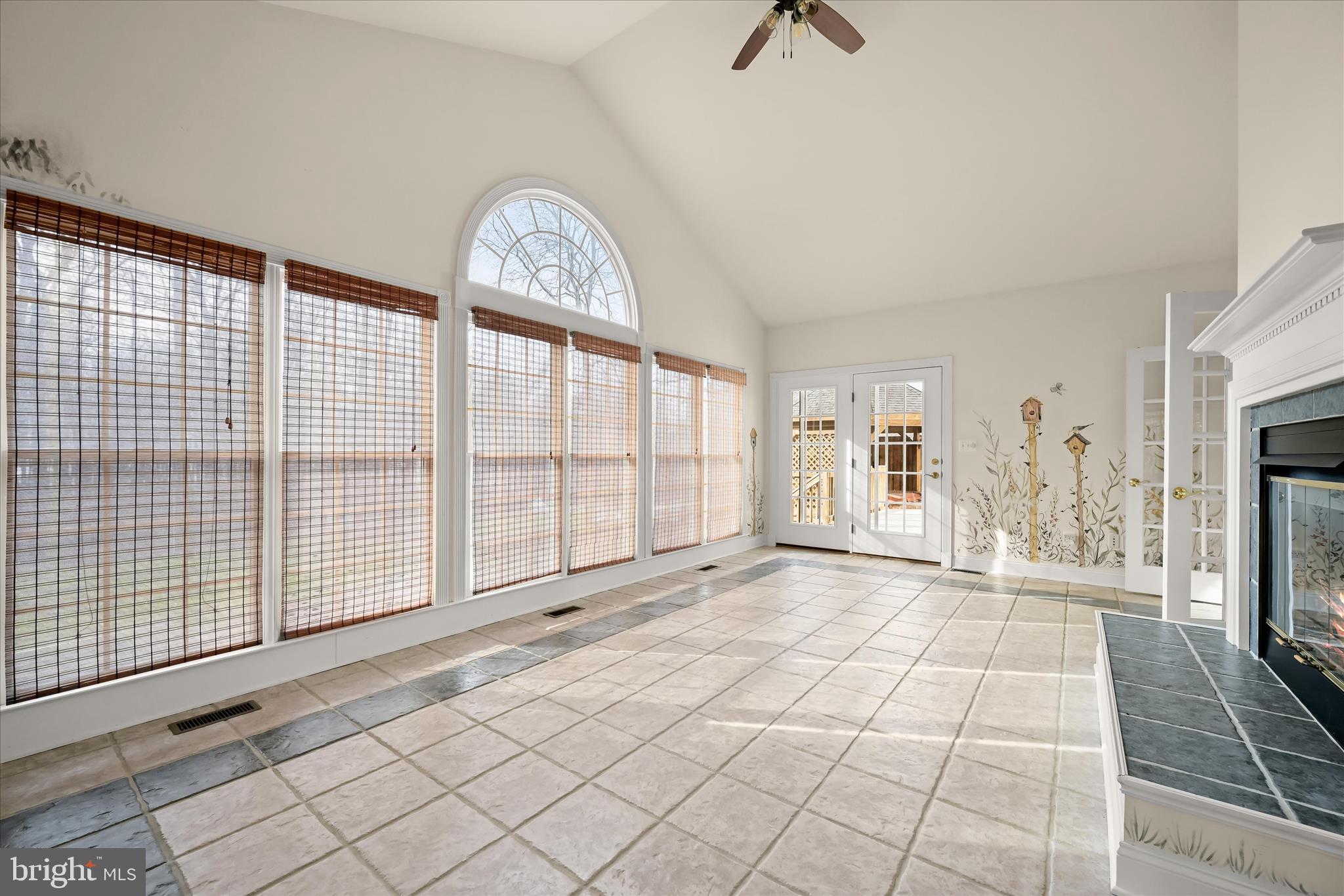 15286 Ridge Hunt Drive Woodbine, MD 21797 - Photo 36 of 100 a view of an empty room with a fireplace and a window