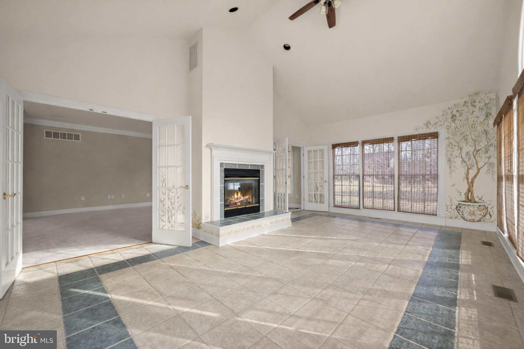 15286 Ridge Hunt Drive Woodbine, MD 21797 - Photo 39 of 100 a view of an empty room with glass door and a window