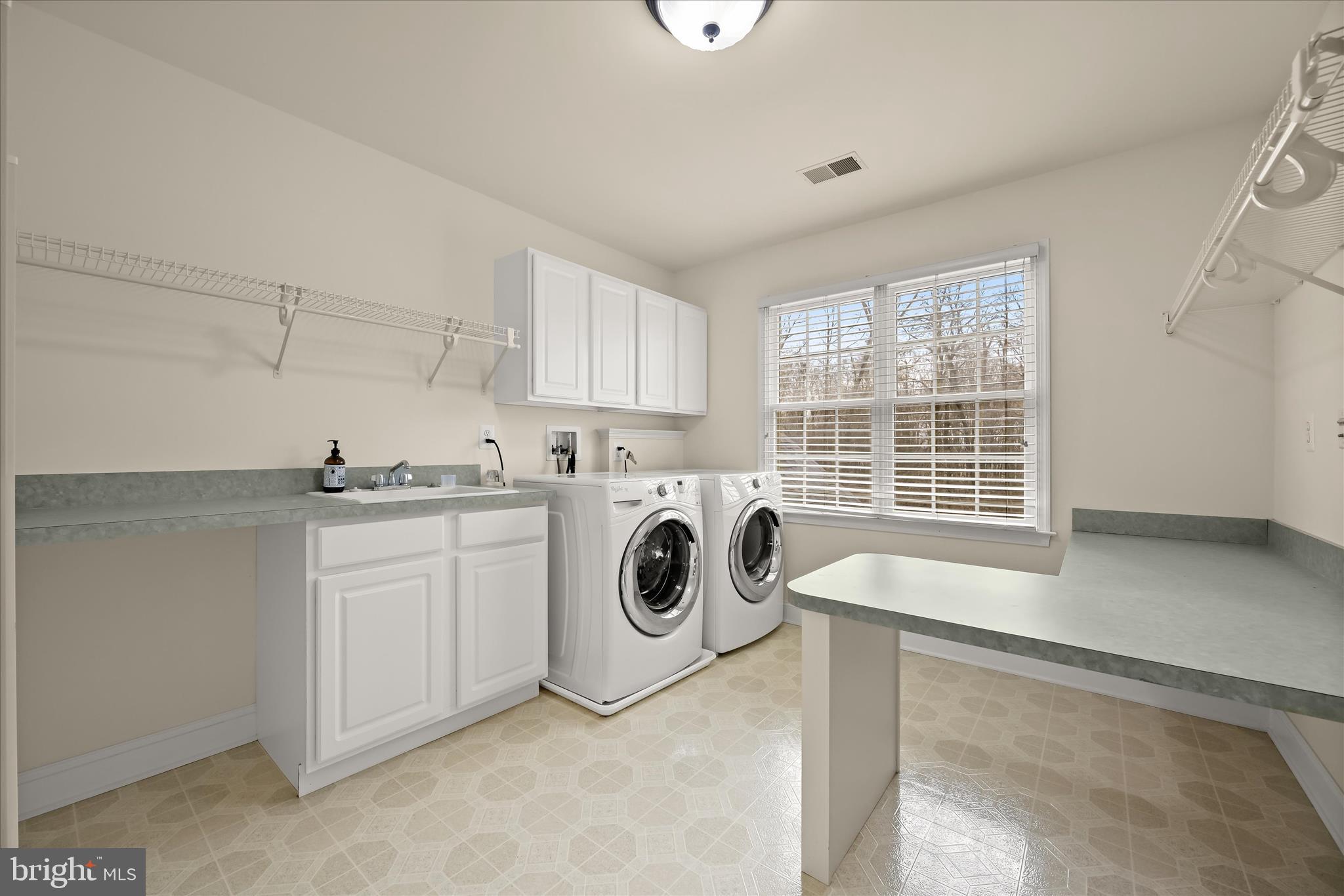 15286 Ridge Hunt Drive Woodbine, MD 21797 - Photo 67 of 100 a utility room with sink dryer and washer