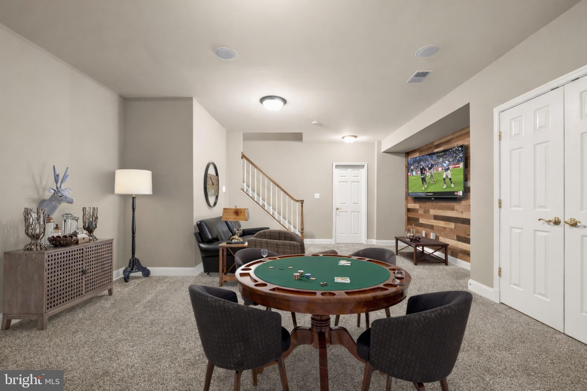 15286 Ridge Hunt Drive Woodbine, MD 21797 - Photo 69 of 100 Carpeted Recreation Room with Accent Wall