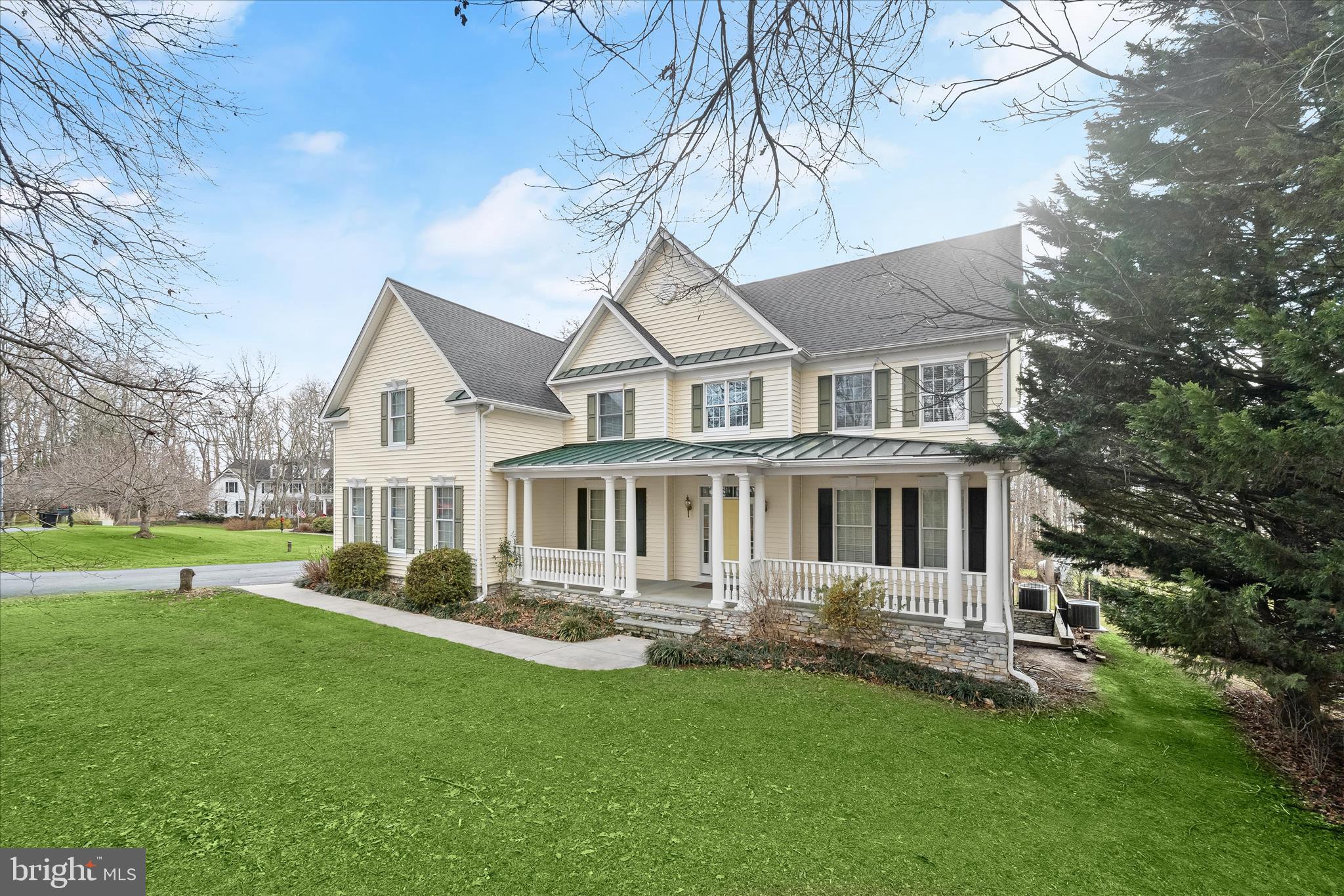 15286 Ridge Hunt Drive Woodbine, MD 21797 - Photo 83 of 100 a front view of a house with a garden and trees