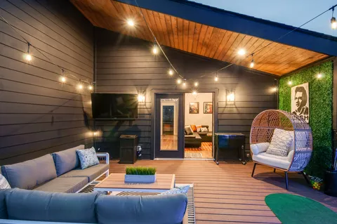 a outdoor living space with furniture and a fireplace