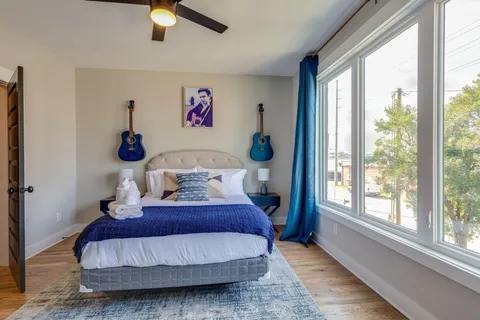 a bedroom with two beds and a dresser