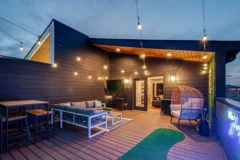 a view of a backyard with sitting area