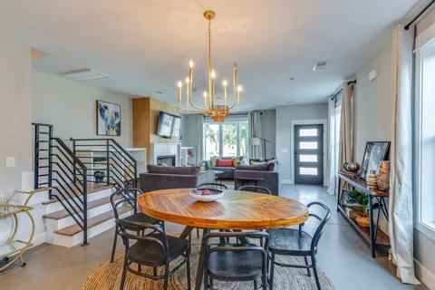 a kitchen that has a sink a stove and a table