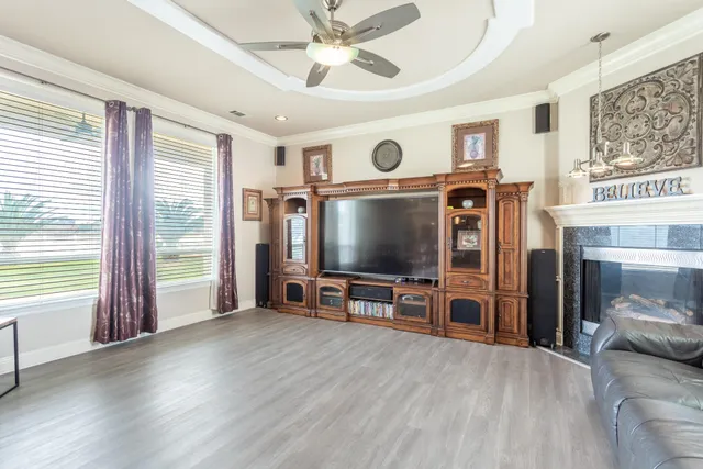 a view of a dining room with furniture and chandelier