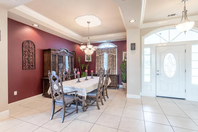 a bed room with a bed and a chandelier