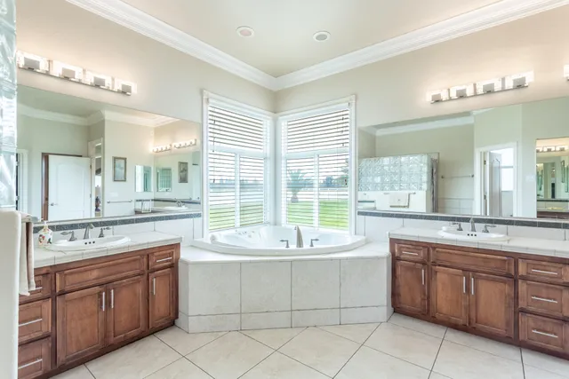 a bath tub sitting in a bathroom next to a window