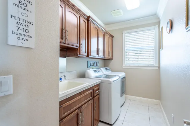 a view of backyard of house and tree