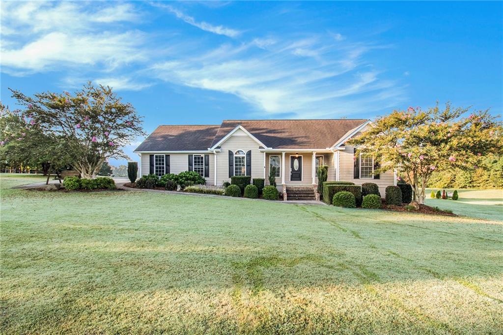 402 Harris Road Lexington, GA 30648 - Photo 1 of 1 a front view of a house with a yard