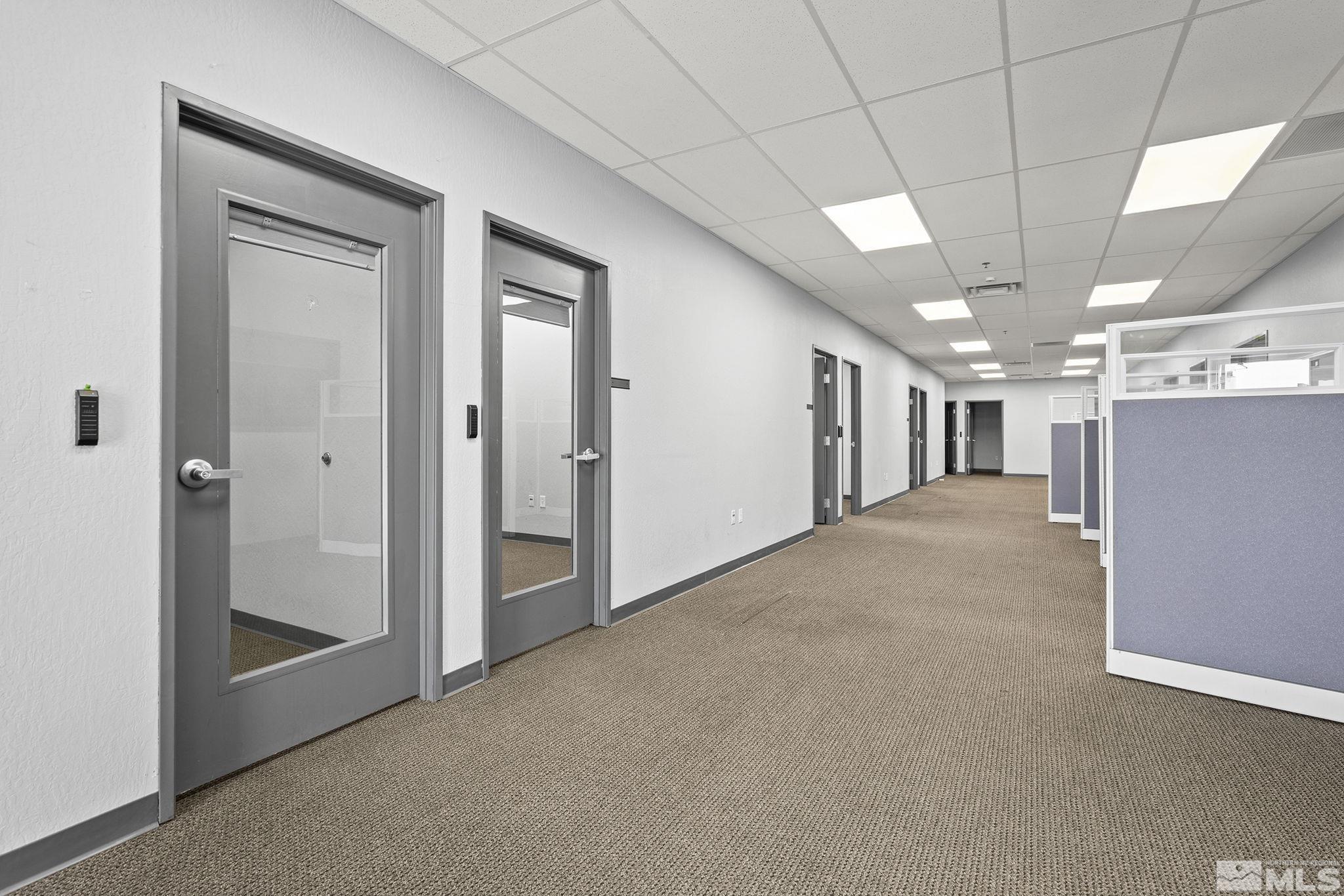 1190 Trademark Drive, Unit 108 108 Reno, NV 89521 - Photo 13 of 20 a view of a hallway with staircase