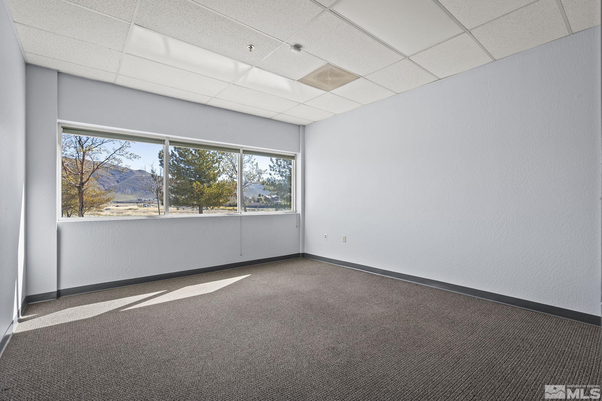 1190 Trademark Drive, Unit 108 108 Reno, NV 89521 - Photo 18 of 20 an empty room with windows