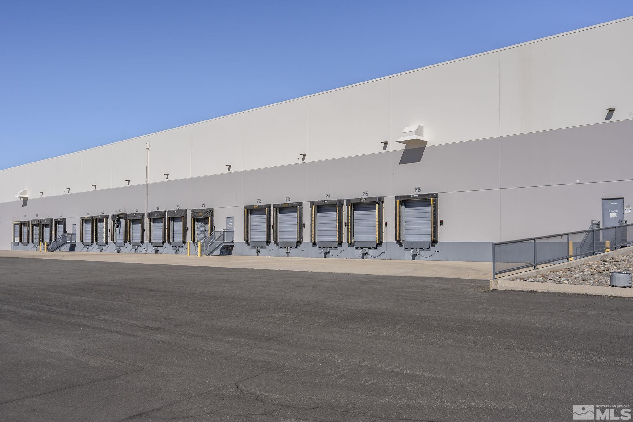 1190 Trademark Drive, Unit 108 108 Reno, NV 89521 - Photo 3 of 20 a white building with a street