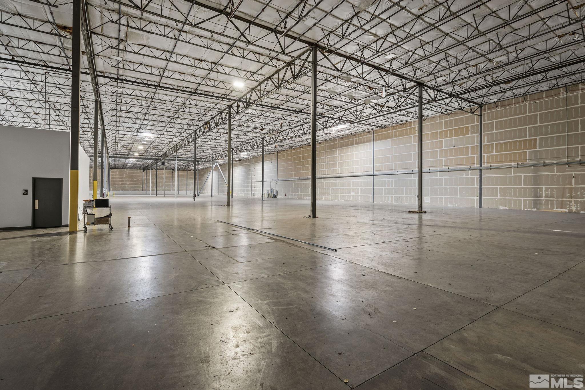 1190 Trademark Drive, Unit 108 108 Reno, NV 89521 - Photo 5 of 20 a view of a room with lots of glass windows and chandelier