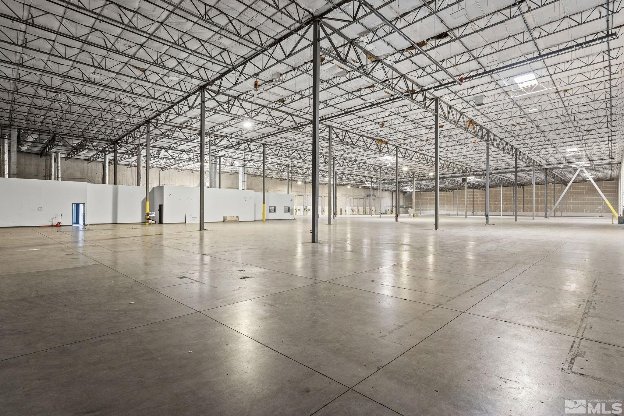 1190 Trademark Drive, Unit 108 108 Reno, NV 89521 - Photo 6 of 20 a view of an empty room with wooden floor