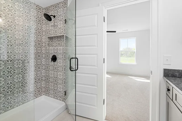 a bathroom with a bathtub and a shower