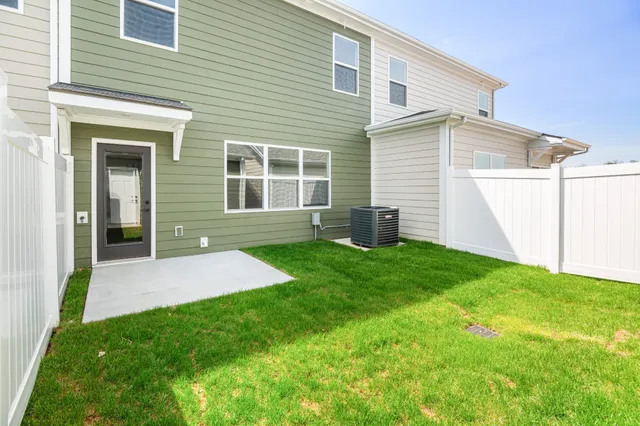a view of an house with backyard space and garden