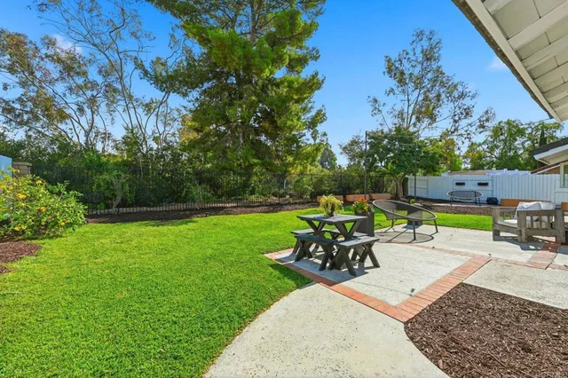 a view of a swimming pool with a patio