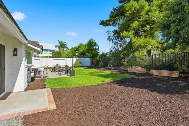 a view of a backyard with a garden