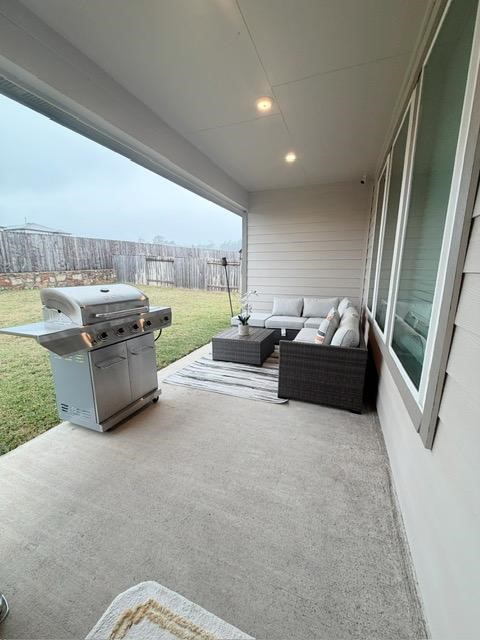 13725 Rising Sun Lane Conroe, TX 77384 - Photo 25 of 29 a living room with furniture and a floor to ceiling window