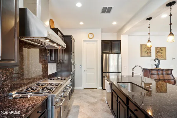 a kitchen with a stove and a sink