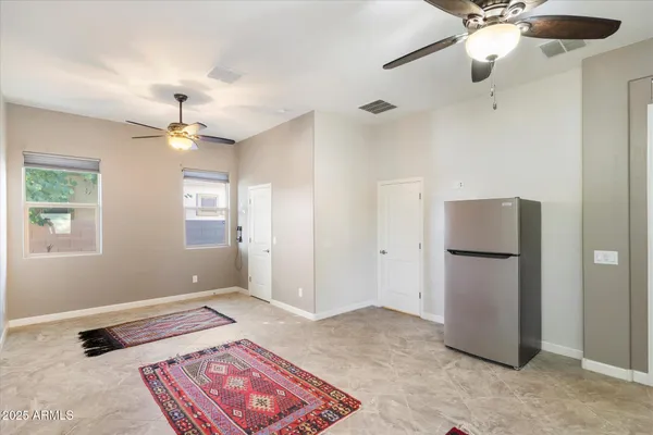 a bathroom with a granite countertop sink a mirror and a shower