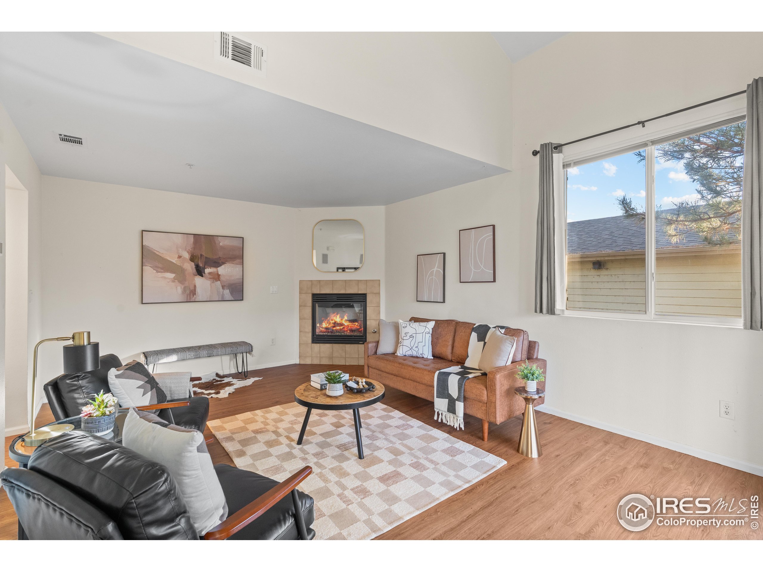 2900 Purcell Street, Unit O4 Brighton, CO 80601 - Photo 11 of 28 a living room with furniture and a fireplace