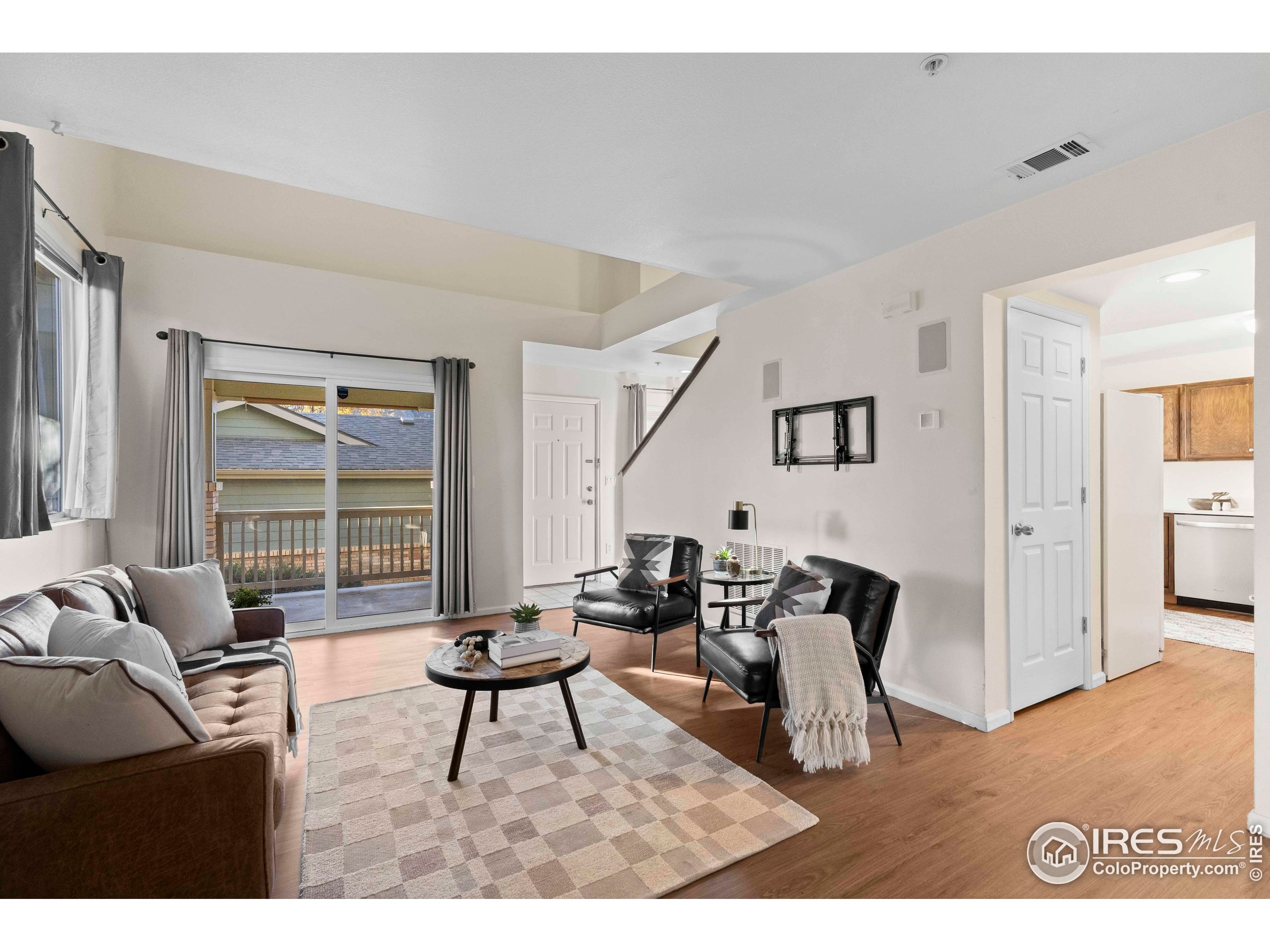 2900 Purcell Street, Unit O4 Brighton, CO 80601 - Photo 12 of 28 a living room with furniture and a window