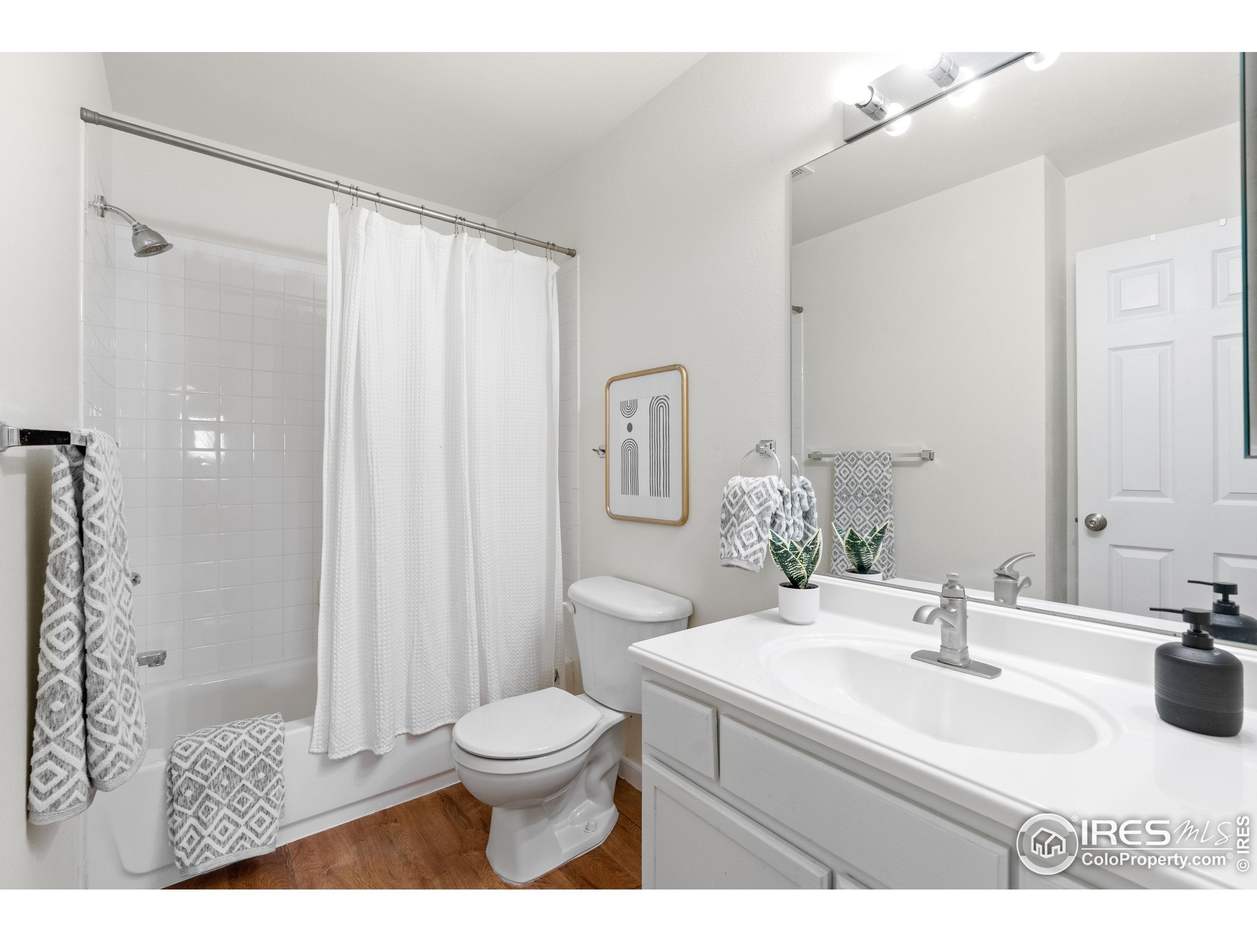 2900 Purcell Street, Unit O4 Brighton, CO 80601 - Photo 23 of 28 a bathroom with a sink toilet and shower