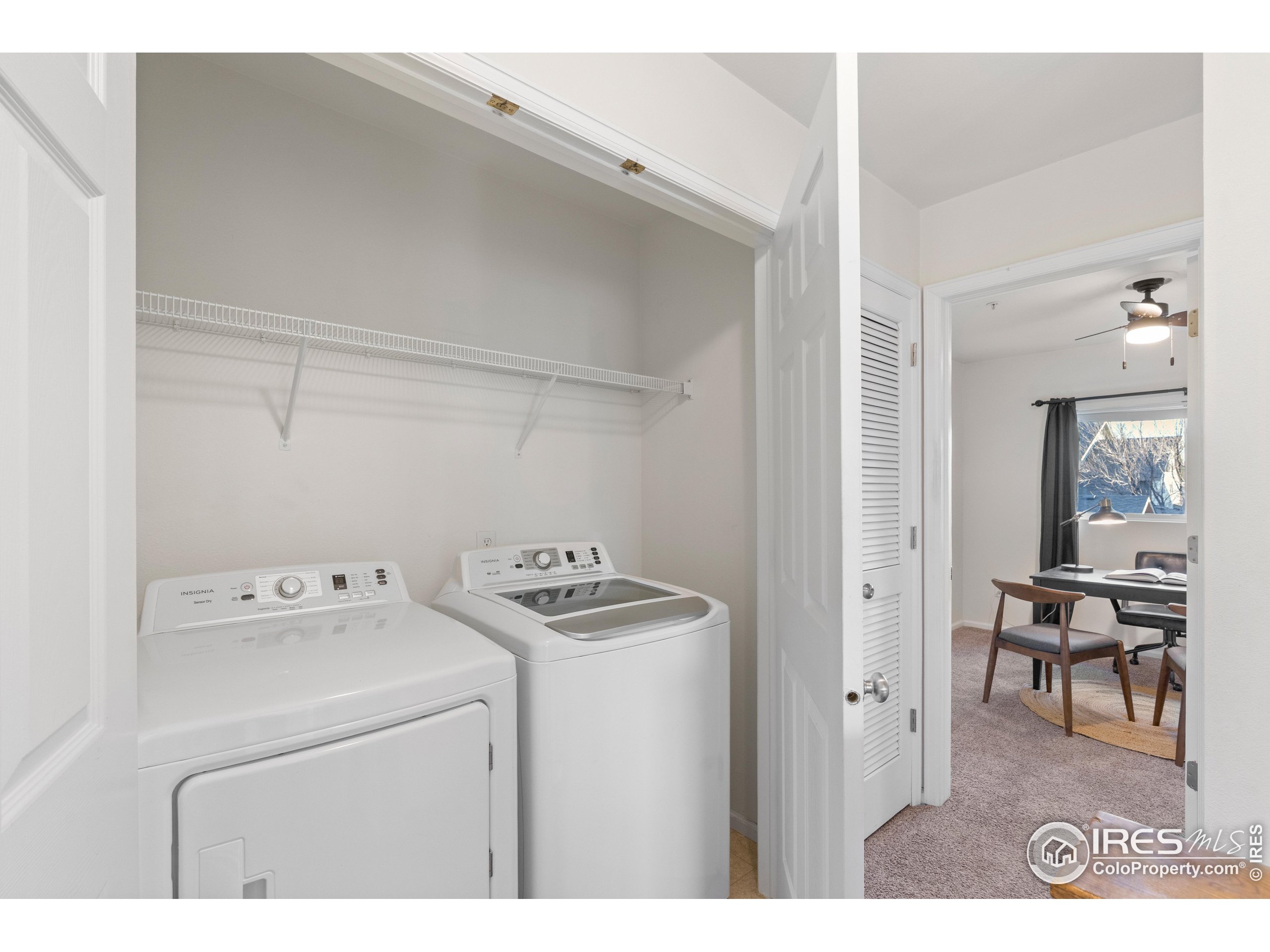 2900 Purcell Street, Unit O4 Brighton, CO 80601 - Photo 24 of 28 a utility room with dryer washer and a view of living area