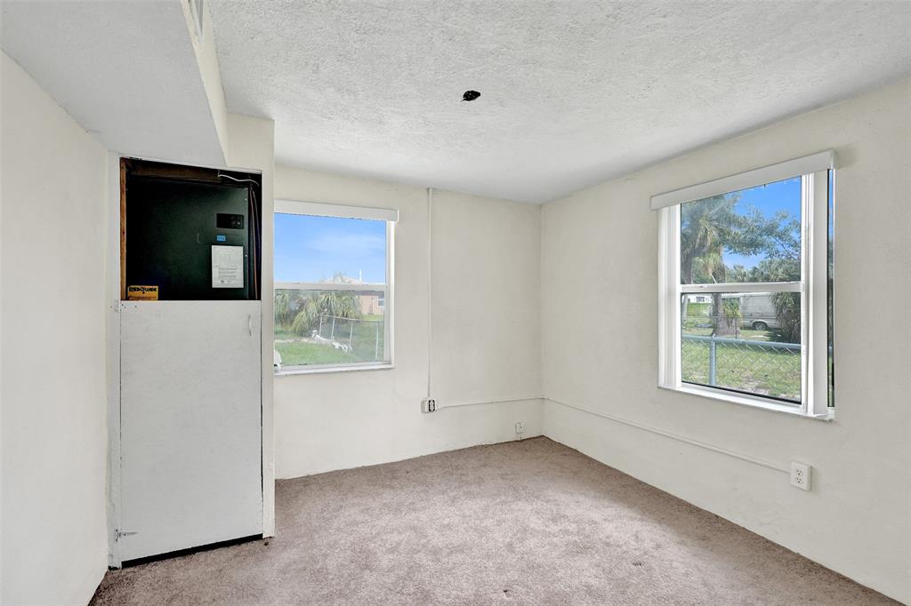 2055 Northwest 8th Street Pompano Beach, FL 33069 - Photo 11 of 20 a view of an empty room with a window