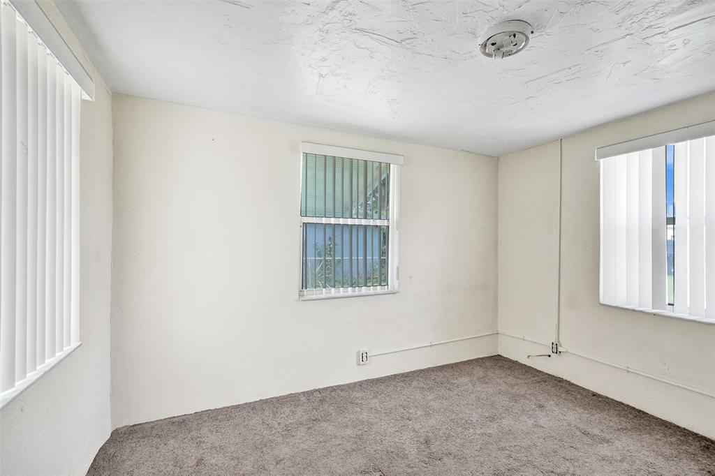 2055 Northwest 8th Street Pompano Beach, FL 33069 - Photo 13 of 20 an empty room with windows