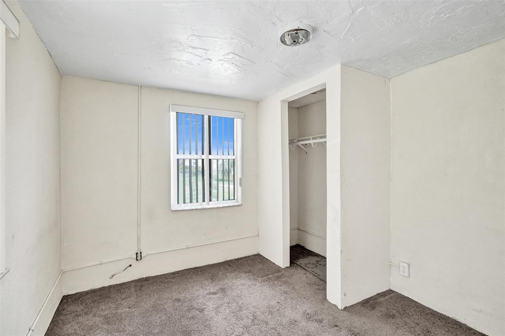 2055 Northwest 8th Street Pompano Beach, FL 33069 - Photo 14 of 20 a view of an empty room with a window