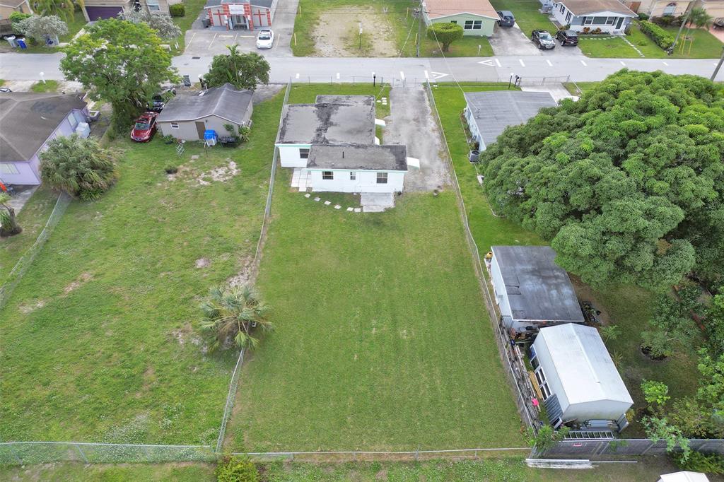2055 Northwest 8th Street Pompano Beach, FL 33069 - Photo 19 of 20 an aerial view of a house with a garden